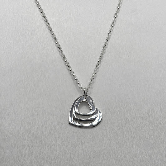 Triple Heart Pendant on a Classic Necklace