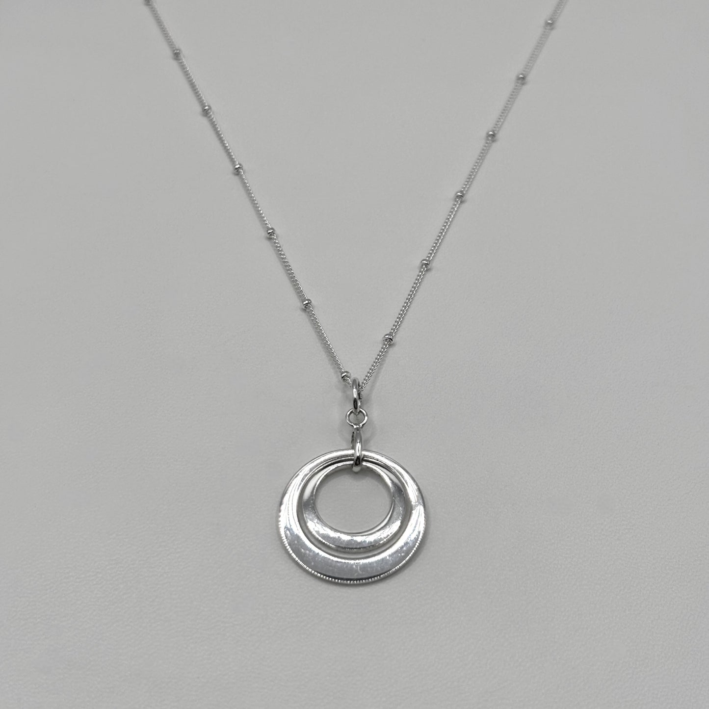 Two Ring Pendant on a Satellite Chain