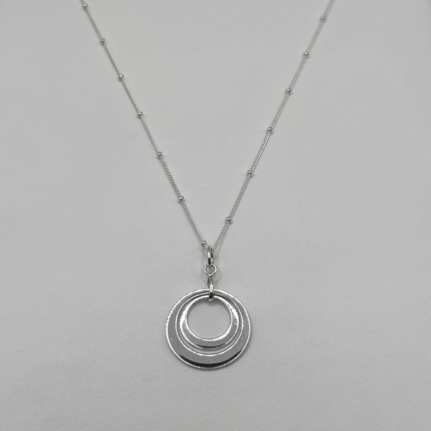 Two Ring Pendant on a Satellite Chain