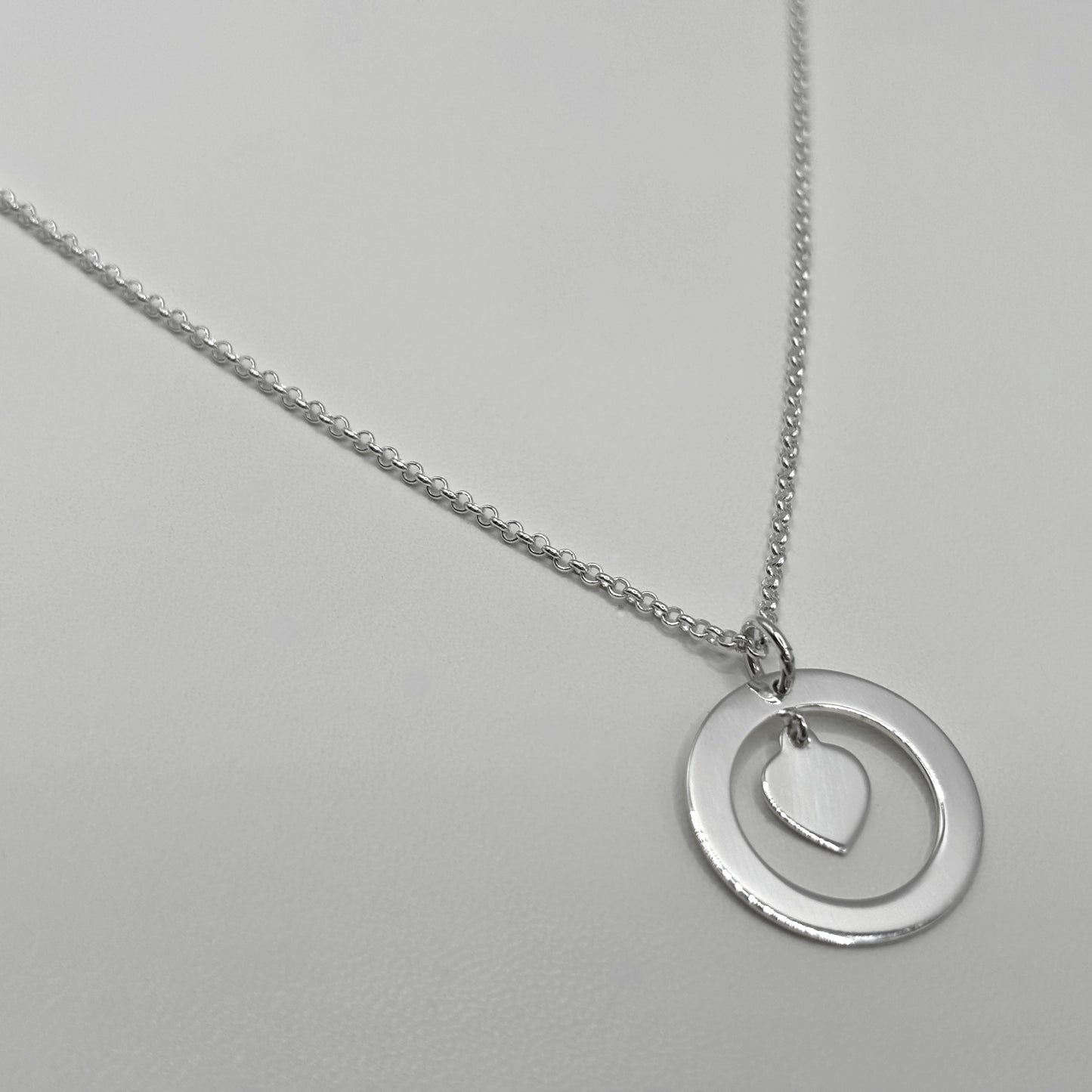 Ring and Heart Pendant on a Fine Classic Necklace