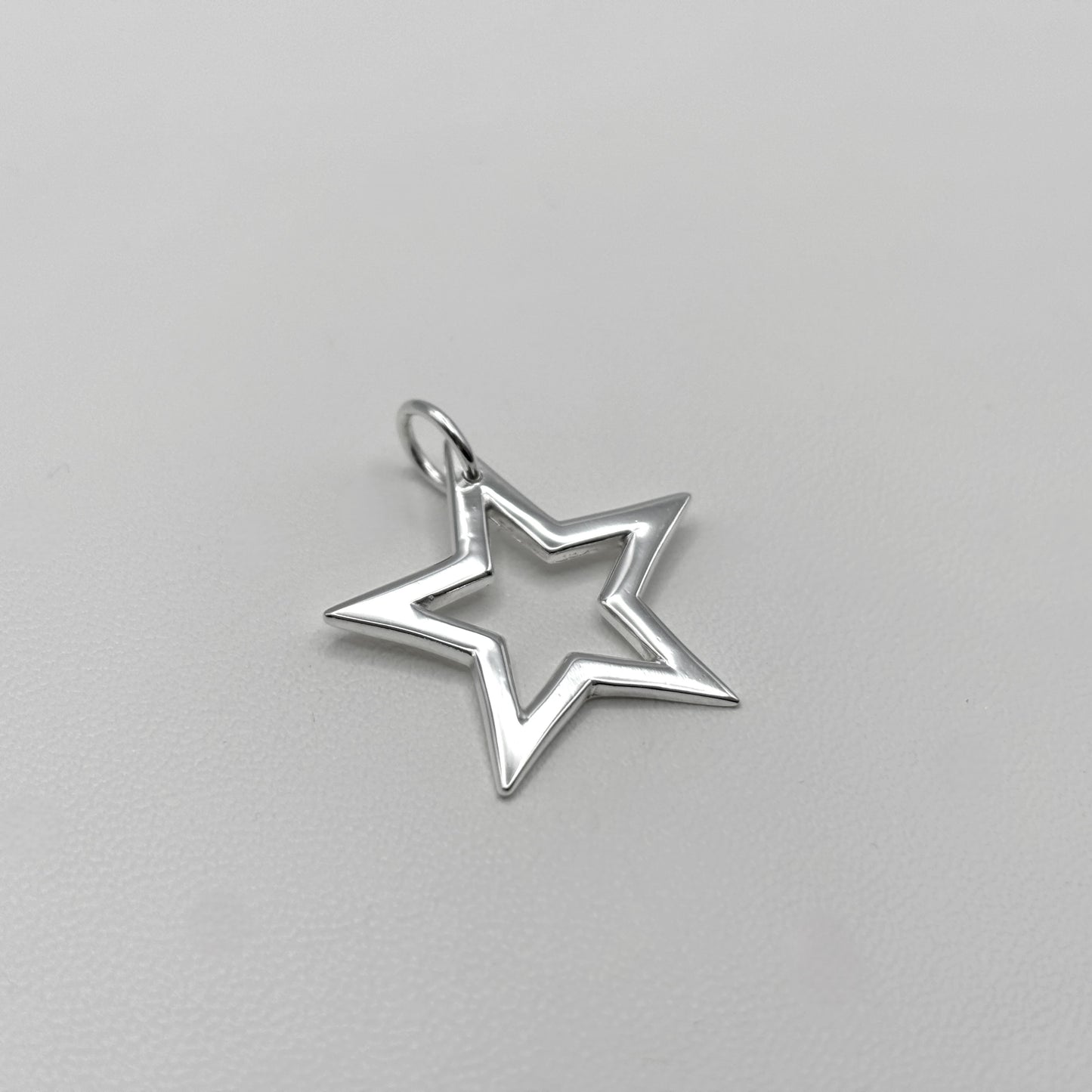 Cut-Out Star Pendant on a Satellite Chain